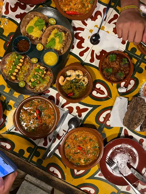 Tapas spread on a tiled table