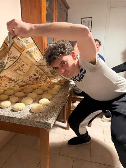 Saverio shaping pizza dough balls