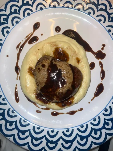 Meat on potato purée with sauce