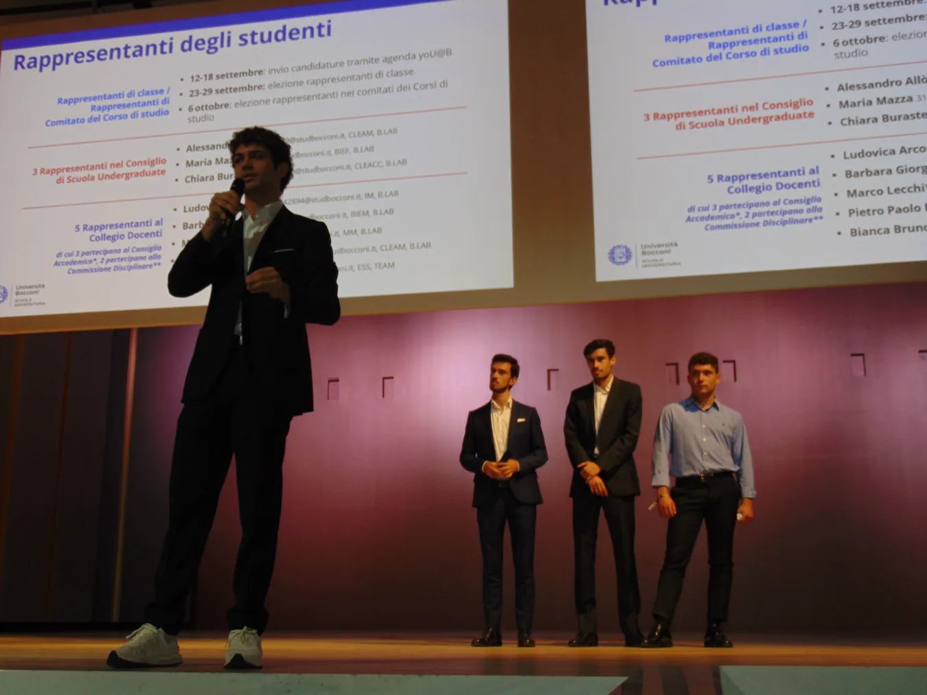 Saverio speaking on stage at the student representatives’ presentation