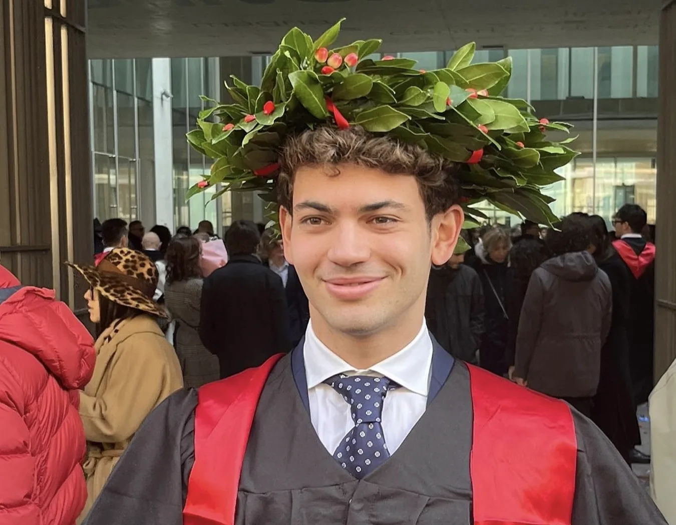 Saverio in his graduation gown with a laurel wreath
