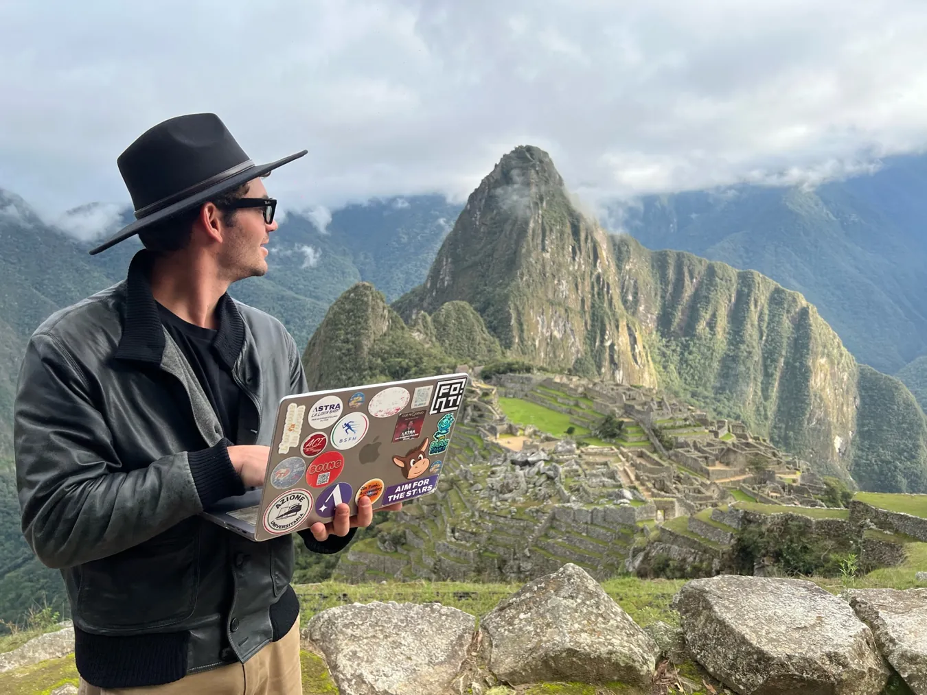Saverio working on a laptop at Machu Picchu